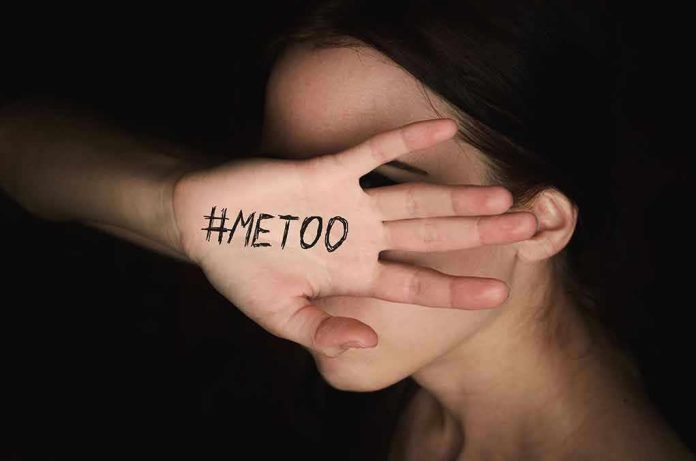 Hand with "#MeToo" covering face.