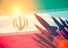 Silhouettes of missiles over Irans flag graphic