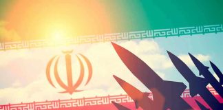 Silhouettes of missiles over Irans flag graphic