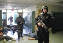 Police officers responding to a school emergency with students on the floor