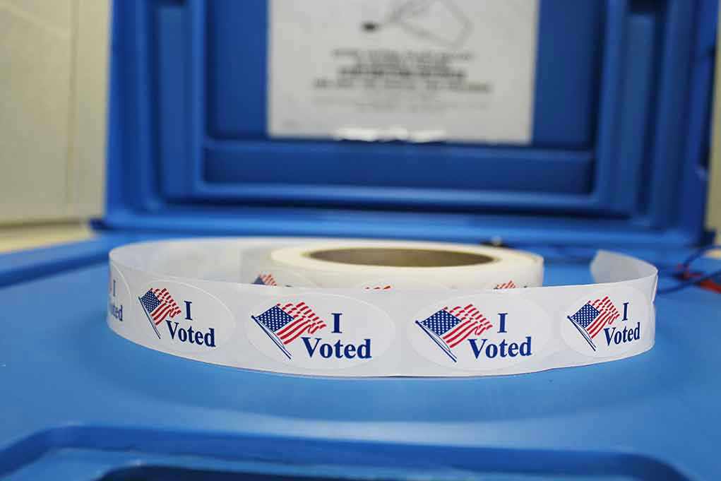 Roll of I Voted stickers on table.